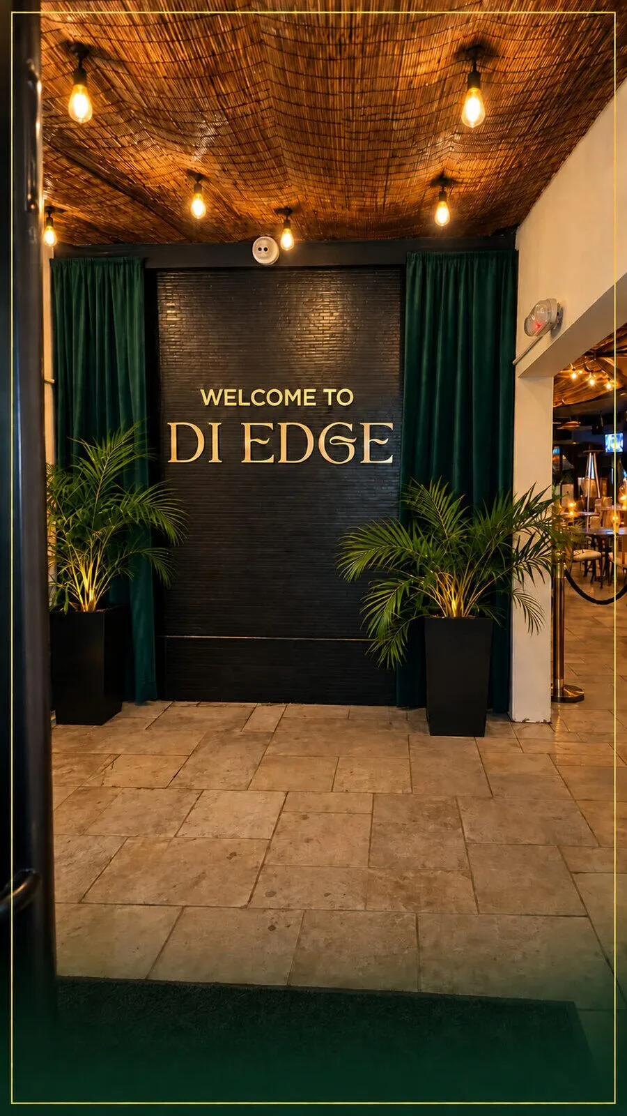 The terrace lamps and palms at Di Edge